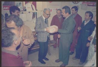 Group photo during retirement party at Malta Drydocks Steel Shop