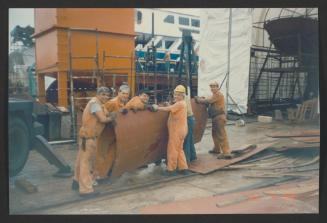 Yacht "Atlantide" at Manoel Island Yacht Yard (Malta) - Manually handling of hull prepared steel plate. Joyful workers.
