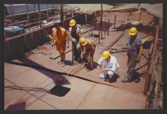 Yacht "Atlantide" at Manoel Island Yacht Yard (Malta) -  mid deck section being fitted in place. Keeping fingers clear.