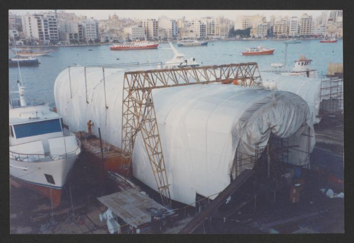 Yacht "Atlantide" at Manoel Island Yacht Yard (Malta) -  under thermo plastic cover. Hull Sand Blasting in progress.