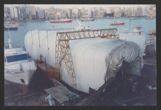 Yacht "Atlantide" at Manoel Island Yacht Yard (Malta) -  under thermo plastic cover. Hull Sand Blasting in progress.