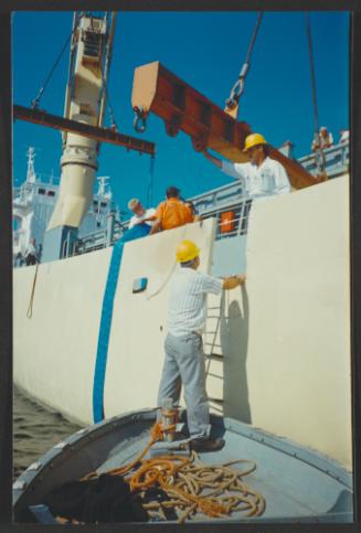 Yacht "Atlantide" at Manoel Island Yacht Yard (Malta) -  lifting preparation on mother ship for transport.