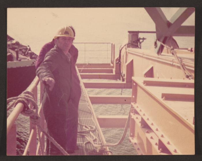 Malta Drydocks unidentified employees working on a platform afloat