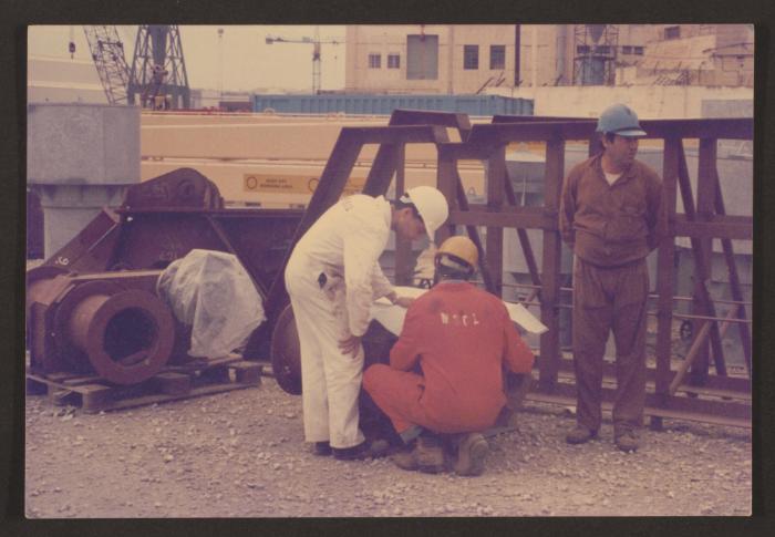 Chargeman Joe Bartolo with his foreman at Malta Shipbuilding (MSCL) co-ordinating on a working drawing.