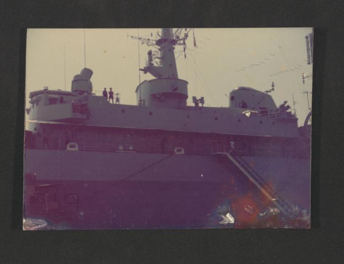 Unidentified Naval ship alogside jetty