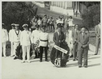 HE the President of Malta Dr. Censu Tabone standing at the foot of the War Memorial monument in Floriana Malta