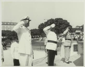 British and Maltese Officers saluting at the War Memorial monument in Floriana Malta