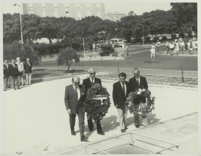 Men from the National War Museum Assoc. laying a wreath on the War Memorial monument in Floriana Malta