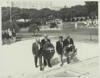 Men from the National War Museum Assoc. laying a wreath on the War Memorial monument in Floriana Malta