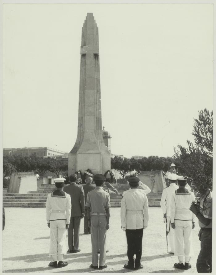 HE the President of Malta Dr. Censu Tabone and attendees standing at the foot of the War Memorial monument in Floriana Malta