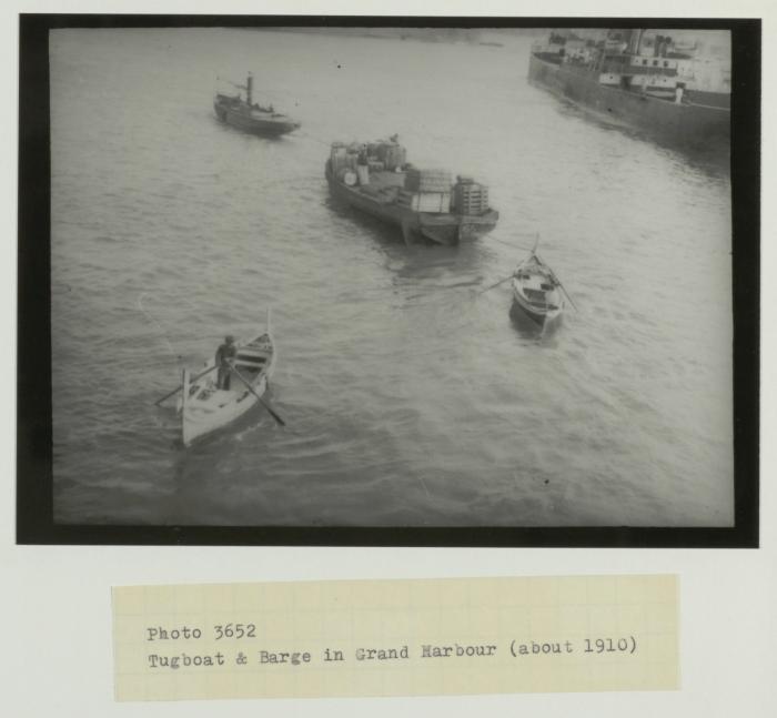 Tugboat and barge in Grand Harbour (circa. 1910)