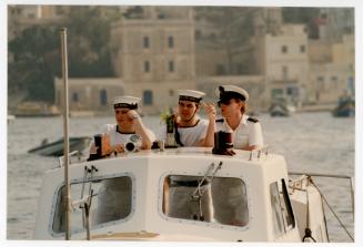 Sailors from "HMS ARK ROYAL" onboard a small boat in Malta