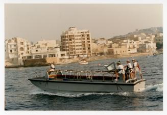 Sailors from "HMS ARK ROYAL" onboard a small boat in Malta