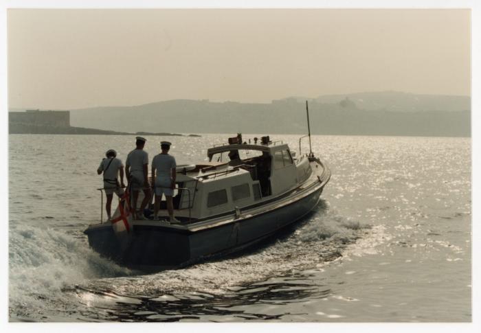 Sailors from "HMS ARK ROYAL" onboard a small boat in Malta