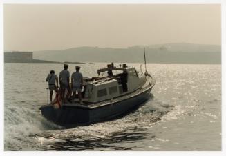 Sailors from "HMS ARK ROYAL" onboard a small boat in Malta