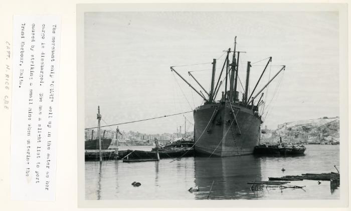 The merchant ship "ORARI" (1931) unloading its cargo in the Grand Harbour, Malta