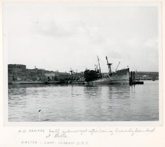 Cargoship "PAMPAS" of the British Royal Mail Line half submerged at Malta after bombardment