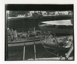 Overhead details of three ships undergoing dry docking in No. 2 Dock