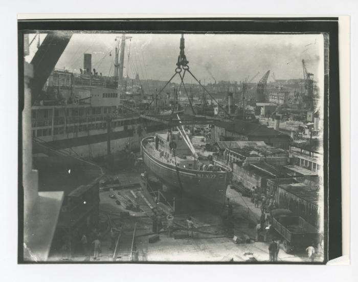 "M.F.V. 77" (Motor Fishing Vessel) lifted on jetty near No. 3 Dock