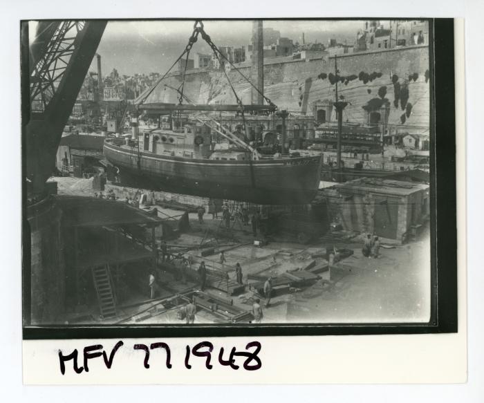 "M.F.V. 77" (Motor Fishing Vessel) lifted on jetty near No. 3 Dock