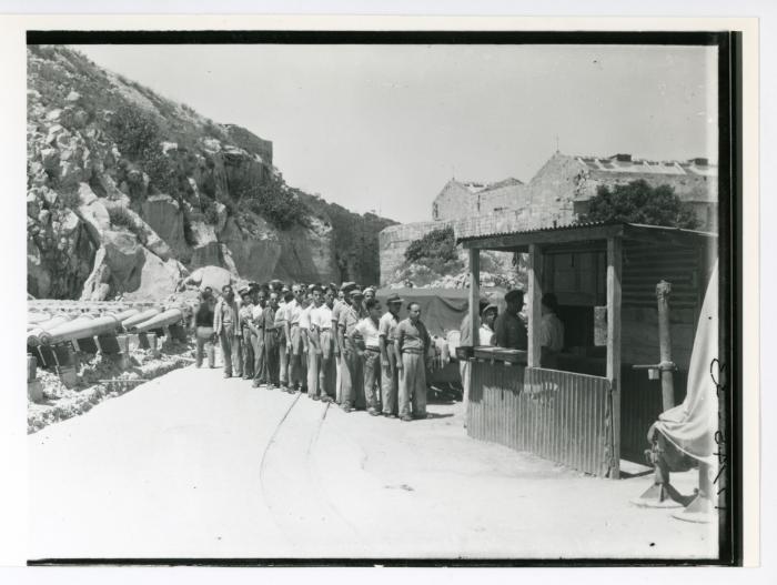 People queuing at a R.N.A.D. (Royal Naval Armaments Depot)