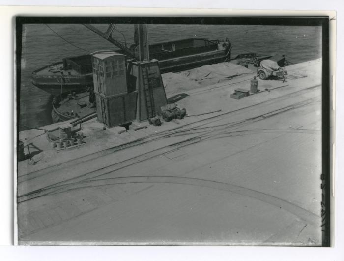 Unloading/loading of barges at Dockyard jetty