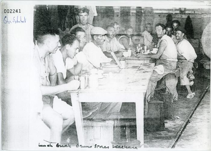 Workers on lunch break at the Bruno Stores in Kalkara, Malta