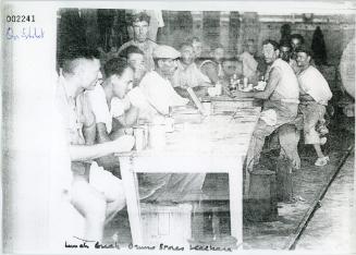 Workers on lunch break at the Bruno Stores in Kalkara, Malta