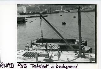 Work at a R.N.A.D. (Royal Naval Armaments Depot) with "TALABOT" in the background