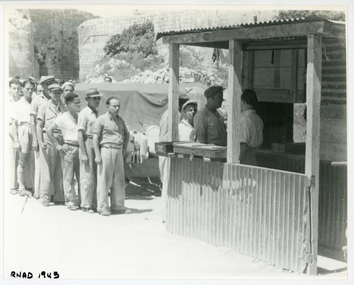 People queuing at a R.N.A.D. (Royal Naval Armaments Depot)