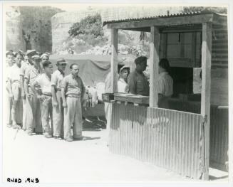 People queuing at a R.N.A.D. (Royal Naval Armaments Depot)