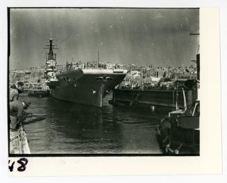 British tugboat (paddle-type) "HMS ROBUST" (1907) assisting in the docking of "HMS OCEAN"
