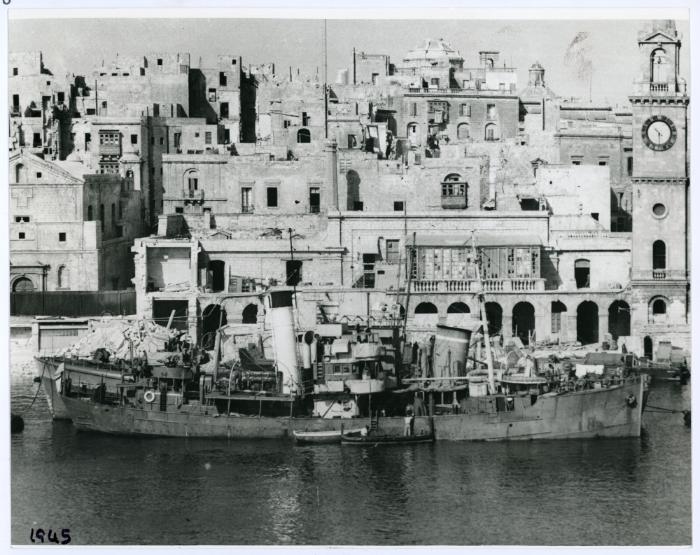 A trawler docked in Dockyard Creek in front of the Royal Naval Bakery, today the Malta Maritime Museum