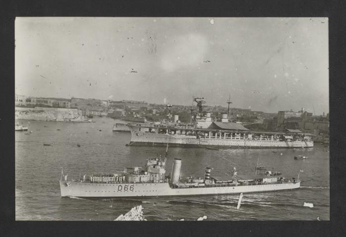 British Modified W-class destroyer HMS Wivern (D66) in the foreground, aircraft carrier HMS Eagle (94) and an unidentified Revenge-class battleship in the background, at Grand Harbour, Malta