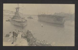 British aircraft carrier HMS Argus (I49), leaving Malta for China, as seen from a battleship and flanked by another battleship, at Grand Harbour, Malta