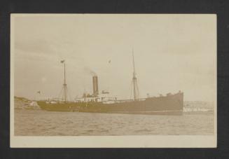 Unidentified auxiliary vessel in port