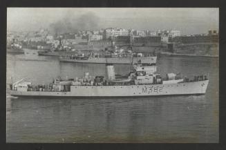 HMS Sylvia (M382) with Pelican and two other vessels in the background