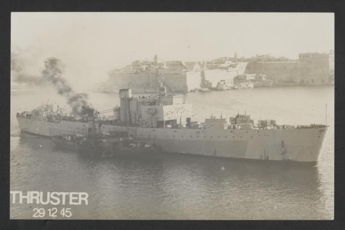 HMS LST 3520, later HMS Thruster, accompanied by a harbour tug