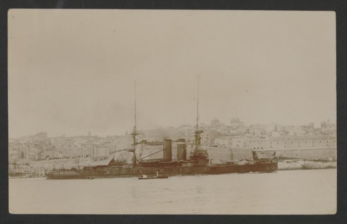 Surface warship with harbour tug in Grand Harbour, Malta