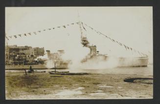 Surface warship with signal flags in (Marsamxett?) Malta