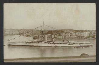 (Iron Duke-class?) battleship in Grand Harbour, Malta, with Corradino in the background