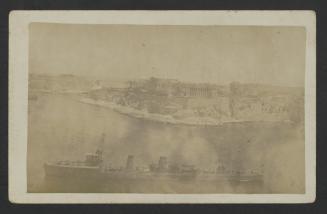 Surface warship (destroyer/torpedo boat) in Grand Harbour, Malta, with Bighi Naval Hospital in the background