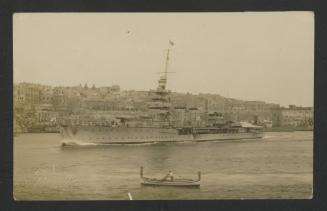 (HMS Coventry?) entering inner Grand Harbour, Malta, with Valletta in the background and a Maltese dgħajsa tal-pass in the foreground