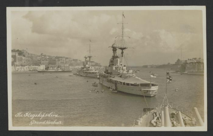 Line of two British battleships in Grand Harbour, Malta; picture taken from another British battleship; captioned "The Flagships Line Grand Harbour"