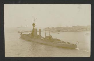 British (dreadnought battleship/heavy cruiser?) missing armament, exiting Grand Harbour, Malta, with Fort Ricasoli in the background
